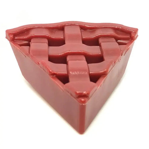 The Cherry Pie EChew Ultra Durable Nylon Dog Chew Toy and Treat Holder by SodaPup is a red, pie slice-shaped toy with a lattice crust design—perfect for keeping your pup entertained and satisfied.