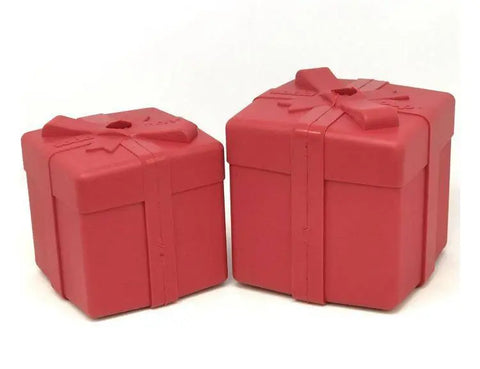 Two red SodaPup Gift Box EDispenser toys with lids and simple bows sit side by side on a white background—ideal as a durable rubber chew toy and treat dispenser for your pet.
