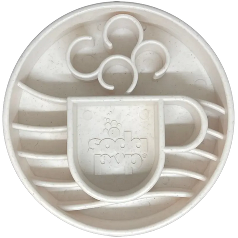 The SodaPup Java Enrichment Slow Feeder Bowl for Dogs features a white, round design with an embossed steaming coffee cup logo for slow feeding and mental stimulation. Made in the USA.