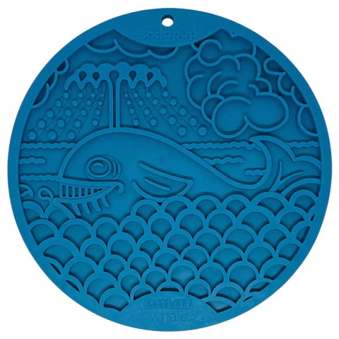 The SodaPup Whale Design EMat Enrichment Lick Mat With Suction Cups features a blue silicone mat with a smiling whale, ocean waves, clouds, and sun rays—ideal for dog enrichment or bath time distraction. SodaPup and emats whale are embossed on the mat.