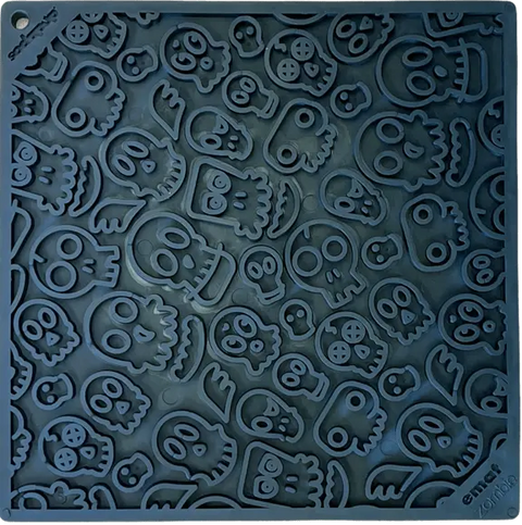 The Zombie Design Emat Enrichment Lick Mat by SodaPup features a fun raised skull-and-bones pattern. This dark blue silicone mat entertains your dog while easing anxiety, serving as both an enrichment toy and lick mat.