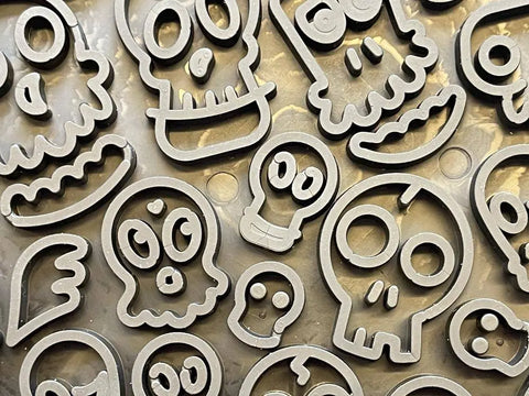 A close-up of SodaPup’s Zombie Design Emat Enrichment Lick Mat features cartoon skulls and ghosts—perfect for making spooky dog treats that double as anxiety-relief enrichment toys.