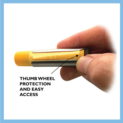 A hand holds the Tallac House Solid Brass Keychain Holder With Dial Protection, made in the USA, featuring a thumb wheel dial and brass ring—easy access and protection in a stylish keychain accessory.