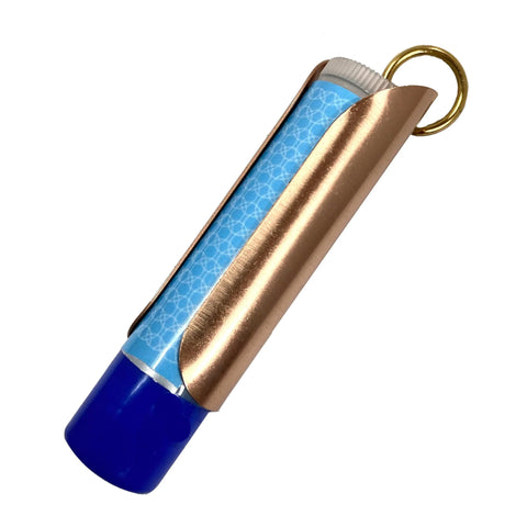 The Tallac House Lip Balm Solid Metal Keychain Holder with dial protection securely holds your lip balm and features a gold keyring—stylish and practical, made in the USA.