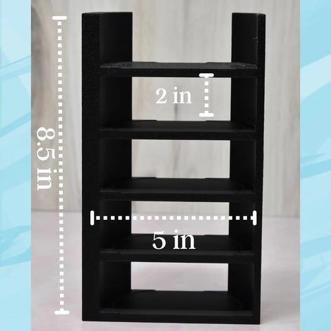 The Chatelet Manufacturing Lid Organizer, compatible with Stanley Cup lids, holds 5 lids and straws. Measuring 8.5 tall, 5 wide, with 2 between shelves, its ideal for cabinets or counters. Shown against a light blue and white patterned background.