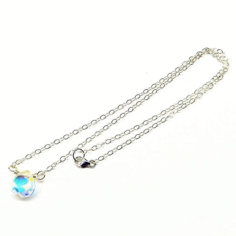 The Alexa Martha Designs Sterling Silver Wire Wrapped Crystal Briolette Drop Necklace features a delicate chain with a sparkling briolette pendant and small lobster clasp, perfect as bridesmaid jewelry, displayed on a white background.