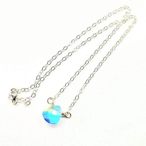 The Alexa Martha Designs Sterling Silver Wire Wrapped Crystal Briolette Drop Necklace features a faceted blue opalite heart pendant on a visible chain with lobster clasp, perfect for bridesmaids. Shown against a white background.