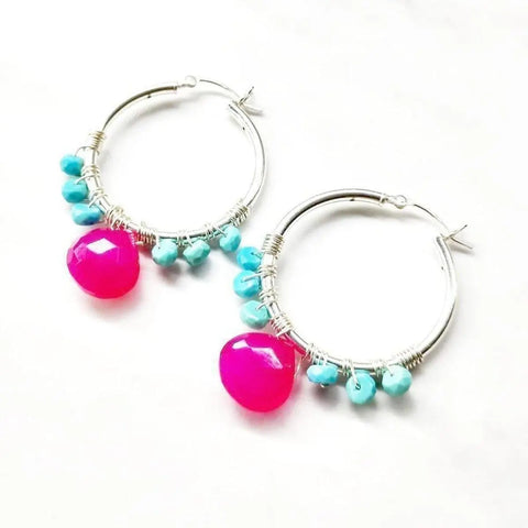 Pink and Sleeping Beauty Turquoise Silver Wire Wrap Hoop Earrings by Alexa Martha Designs feature sterling silver hoops with turquoise beads and a large bright pink bead on each, displayed against a white background.
