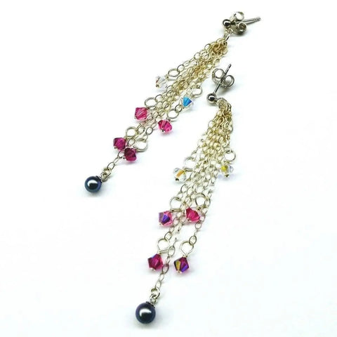 Long Sterling Silver Crystal Pearl Tassel Earrings by Alexa Martha Designs feature handmade chain dangles with small purple and clear Swarovski crystal beads and a single round dark pearl on each earring. Shown on a white background.