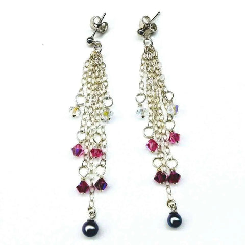 The Alexa Martha Designs Long Sterling Silver Crystal Pearl Tassel Earrings feature clear and magenta crystal beads, multiple dangling chains, and a dark pearl drop—elegant handmade fringe earrings for a standout look.