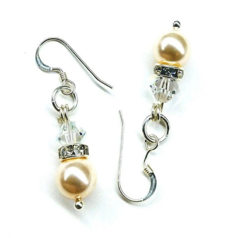 Alexa Martha Designs Silver Swarovski Crystal Pearl Stack Earrings, shown in cream pearls and clear crystals with silver hooks, are elegantly displayed on a white background.