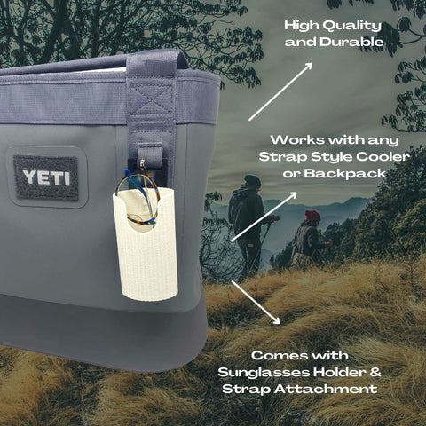 Close-up of a gray Yeti cooler with the Chatelet Manufacturing Sunglasses Holder Attachment, which fits any soft Yeti cooler or backpack with straps. Made in the USA, it securely holds your sunglasses and easily attaches to any strap. Two hikers in the background.