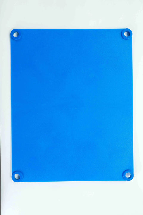 The Karving King Supplement Cutting Board is a flat, square blue silicone mat with holes in each corner. Non-slip and BPA free, this accessory is shown placed on a white surface.