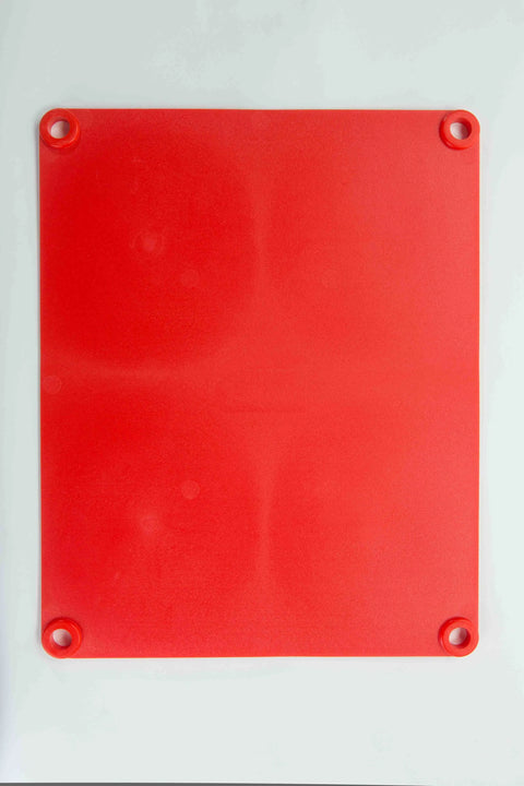 The Karving King Supplement Cutting Board is a rectangular red BPA-free board with rounded corners and holes in each corner, displayed on a white surface.
