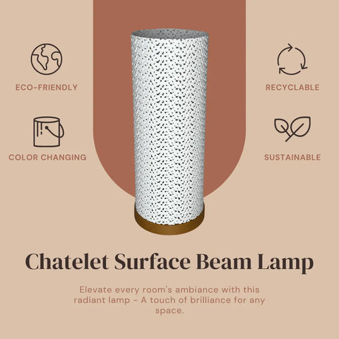 The Surface Beam Lamp by Chatelet Manufacturing is a tall, cylindrical lamp with a patterned surface and gold base, shown on a brown and beige background. Icons highlight its eco-friendly, recyclable design and ambient color-changing LED features.