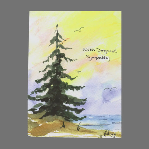 JuLu Cards Pack of 4 With Deepest Sympathy cards (20007) features an evergreen tree on a shoreline, a colorful sky, and birds. The message expresses love and cherished memories during difficult times.