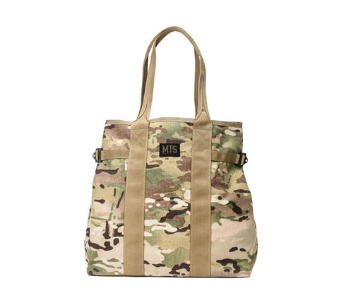The MIS Multi Tote Bag - Multi Cam features a camouflage Cordura nylon design with two tan handles, two front vertical tan straps, and a black patch with green “MIS” lettering—combining water resistance, durability, and style.