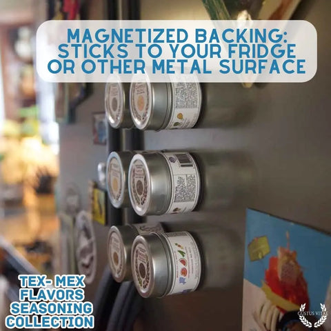 Six metal Gustus Vitae spice tins from the Tex-Mex Gourmet Seasoning 6-Pack Collection are magnetically attached to a fridge, showcasing their magnetized backs and all-natural seasonings. The kitchen is visible in the background. Handcrafted in the USA.