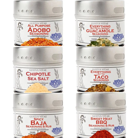 The Gustus Vitae Tex-Mex Flavors Seasoning Collection includes six tins—All Purpose Adobo, Guacamole, Chipotle Sea Salt, Everything But The Taco, Spicy Baja, and Sweet Heat BBQ—arranged in two columns and three rows.