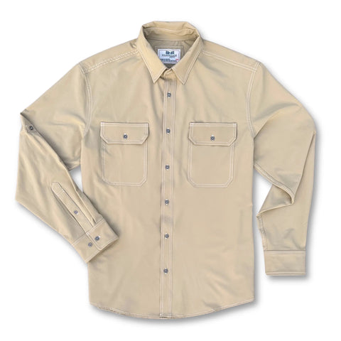 The Nash Button Down Shirt - Desert by Wilson Lane Apparel is a long-sleeve beige shirt with two chest pockets and white stitching, designed for comfort and made in the USA, shown flat on a white background.