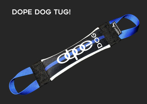 The Thin Blue Line Dope Dog Fire Hose Training Tug by Bulletproof Pet Products Inc is a black, white, and blue dog toy with DOPE DOG printed on it, two blue handles for easy grip, and DOPE DOG TUG! in white on the black top left.