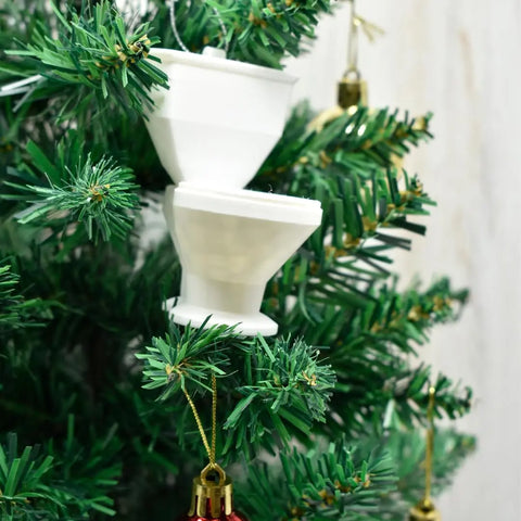 Two Chatelet Manufacturing Toilet Bowl Christmas Tree Ornaments hang on a green tree, surrounded by red and gold baubles.
