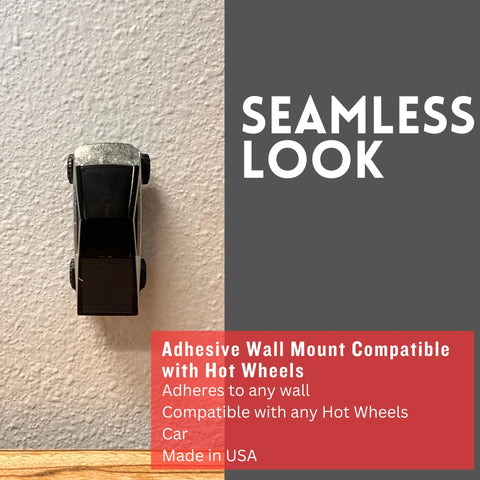 A black toy car is vertically mounted on a light wall with a small adhesive holder. Text says “SEAMLESS LOOK” and features Chatelet Manufacturing’s Toy Car Wall Display Organizer, compatible with Hot Wheels, made in the USA.