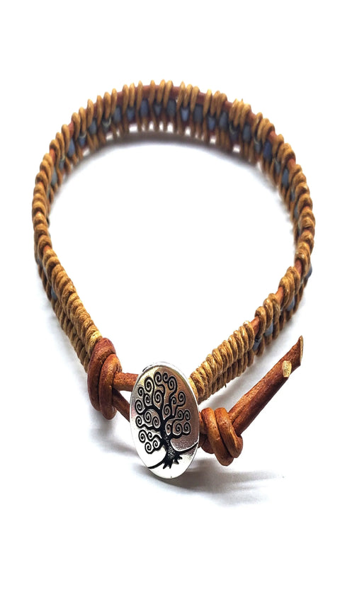 The Tree of Life Button Brown Gray Leather Wrap Seed Bead Bracelet by Alexa Martha Designs features brown woven leather, a silver tree of life button, and a simple loop closure.