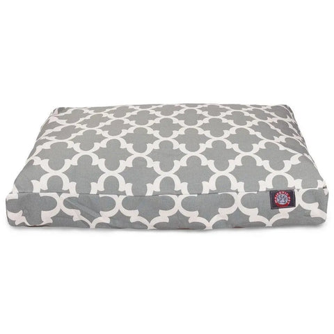 The Majestic Pet Trellis Rectangle Dog Bed features a gray and white geometric design, premium polyester fill, a small red and white label, and a washable cover for easy cleaning.