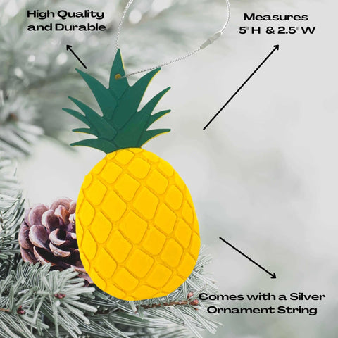 The Pineapple Christmas Ornament by Chatelet Manufacturing features vibrant yellow and green detail, measures 5 x 2.5, and includes a silver string for hanging. Made in the USA, its perfect for adding a festive touch to your holiday tree.