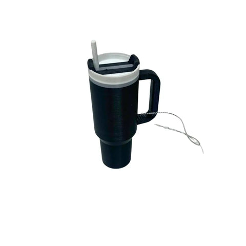The Chatelet Manufacturing Tumbler Cup Replica Christmas Ornament is a black mug-shaped holiday ornament with a handle, white lid, straw, and tea bag tag—an eye-catching 2023 water bottle replica for your tree. Made in the USA.