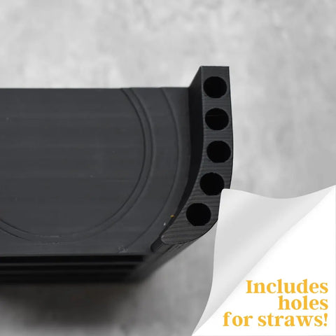 Close-up of a black Chatelet Manufacturing Lid Organizer Rack compatible with Yeti Rambler & Tumblers—holds 5 lids plus metal straws. Text in the corner reads: Includes holes for straws! Made in USA.