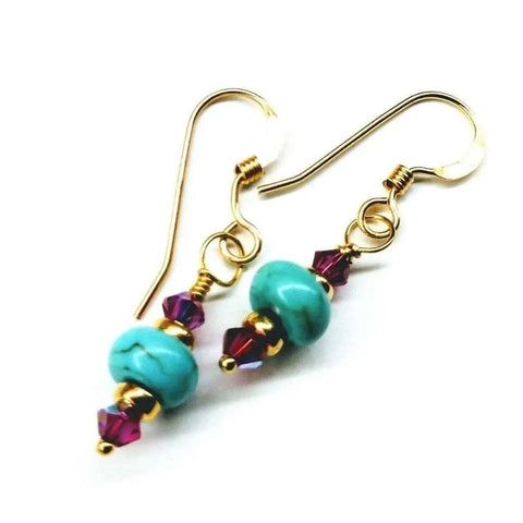 Alexa Martha Designs Hot Pink and Turquoise 14K Gold Filled Earrings, featuring gold hooks, turquoise beads, gold spacers, and hot pink Swarovski accents, displayed on a white background.