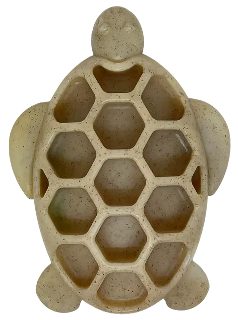 The SodaPup Turtle EChew Durable Nylon Chew and Enrichment Toy features hexagonal compartments, a smiling face, and flippers—perfect as a fun, beige turtle-shaped tray for pets to chew and enjoy.