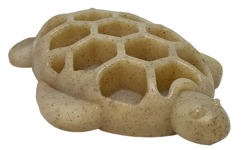 The SodaPup Turtle EChew Durable Nylon Chew and Enrichment Toy is a beige, turtle-shaped toy with hexagonal holes and a speckled, stone-like finish, perfect for enrichment and chewing.