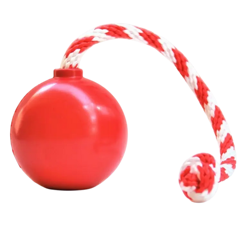 The SodaPup USA-K9 Cherry Bomb durable rubber dog chew toy with a red-and-white braided rope loop is shown on a plain white background. This treat dispenser and tug toy is made in the USA.