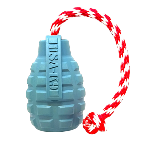 The SodaPup USA-K9 Grenade Durable Rubber Chew Toy in Steel Blue features a red and white braided rope with a knotted end, making it perfect as a treat dispenser, tug, and retrieving toy. Shown on a plain background.