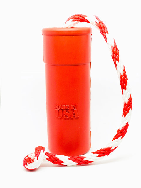 The SodaPup USA-K9 Firecracker Durable Rubber Floating Training Dummy, Large and Red, features Made in USA embossing and a red-and-white braided rope—perfect for canine training sessions. Shown on a plain white background.