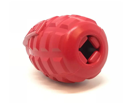 The SodaPup USA-K9 Grenade EDispenser is a red, textured, durable rubber chew toy and treat dispenser for power chewer dogs, designed in an oval grenade shape with an opening for stuffing treats.