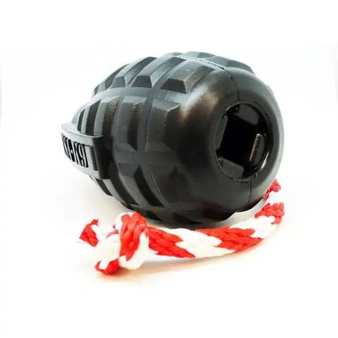 The SodaPup USA-K9 Magnum Grenade is a durable black chew and reward toy with a textured surface and a red-and-white braided rope attached, shown on a white background.