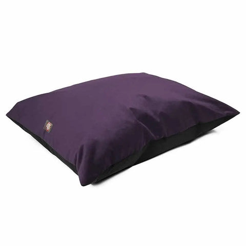 The Majestic Pet Velvet Super Value Dog Bed is a large, rectangular, purple bed with a black base and small fabric tag, shown on a white background.
