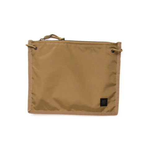 The MIS 2 Way Pouch in Coyote Brown is a flat, rectangular nylon clutch with a top zipper, metal grommets on two corners, and a small black label—ideal as a water-resistant pouch for your everyday essentials.