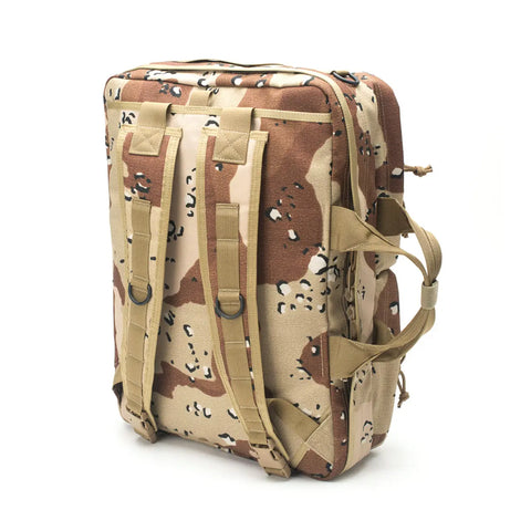 The MIS 3 Way Brief Bag in Chocochip Desert Camo features durable Cordura nylon, adjustable straps, a handle, and multiple zippered compartments. Water-resistant and versatile, it’s ideal for everyday use. Shown on a white background.