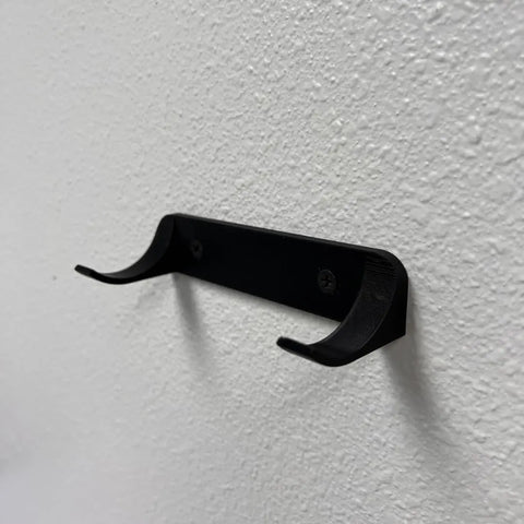 The Chatelet Manufacturing Vertical Collectible Car Wall Display Mount, made in the USA and compatible with Lego Technic Series racecars, securely attaches to textured white walls for displaying your car collection by Wheels on Wall.