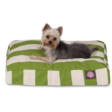 A small Yorkshire Terrier rests on the Majestic Pet Vertical Stripe Rectangle Dog Bed, featuring premium polyester fiber fill and a green and white washable cover, gazing at the camera.