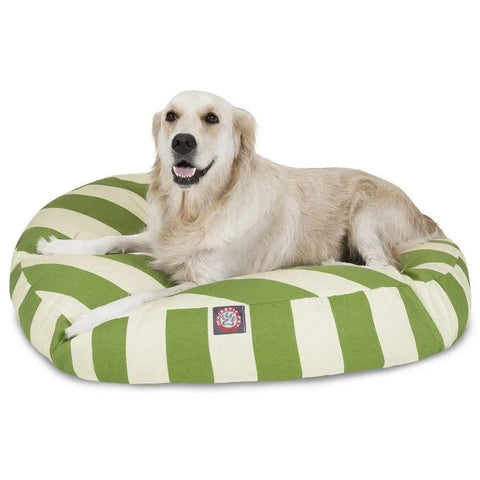 A golden retriever rests comfortably on the Majestic Pet Vertical Stripe Round Dog Bed, which has green and white stripes and a washable, removable cover for easy cleaning.