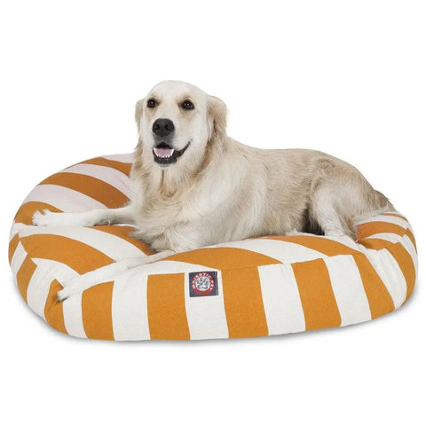 A golden retriever relaxes on the Majestic Pet Vertical Stripe Round Dog Bed, featuring bold orange and white stripes and a removable, easy-to-wash cover for lasting comfort and cleanliness.
