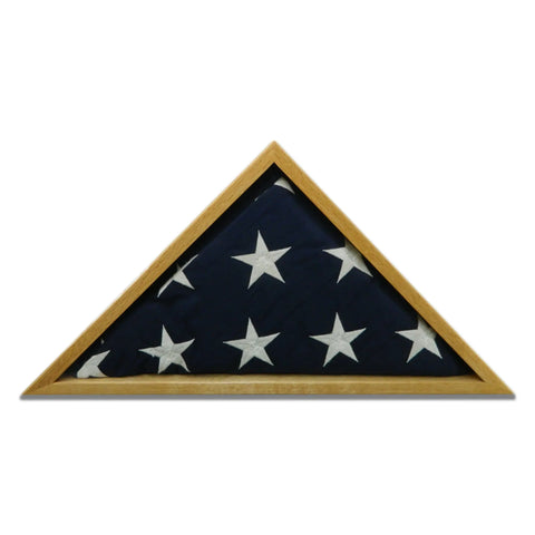 A 5 x 9.5 folded American flag with white stars on blue is displayed in the Oak Burial Flag Display Case by Legacies of America Woodworking Company, expertly crafted from oak and made in the USA.