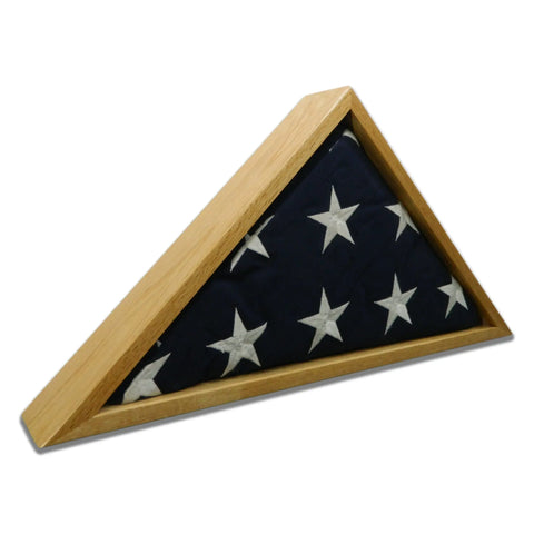 The Legacies of America Woodworking Company Oak Burial Flag Display Case (for 5 x 9.5 flags) beautifully displays a folded American flag with visible white stars. Expertly crafted from oak hardwood and proudly made in the USA.