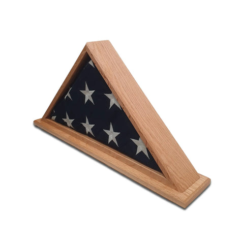 The Legacies of America Woodworking Company Oak Burial Flag Display Case (for 5 x 9.5 flags) features a folded American flag with visible stars in a triangular wooden frame, crafted by veterans and proudly made in the USA.